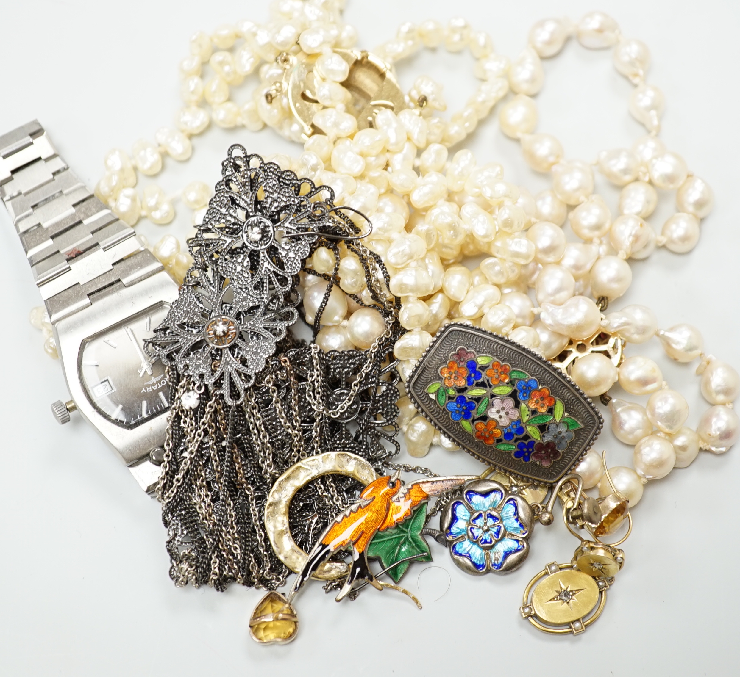 A group of assorted costume jewellery including two baroque pearl necklaces and a pair of Victorian diamond set drop earrings